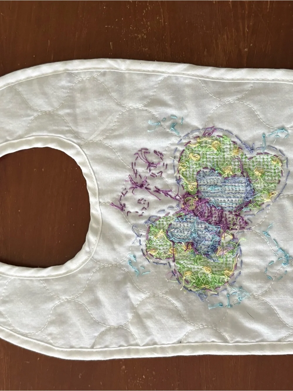 Hand embroidered butterfly quilted baby bib